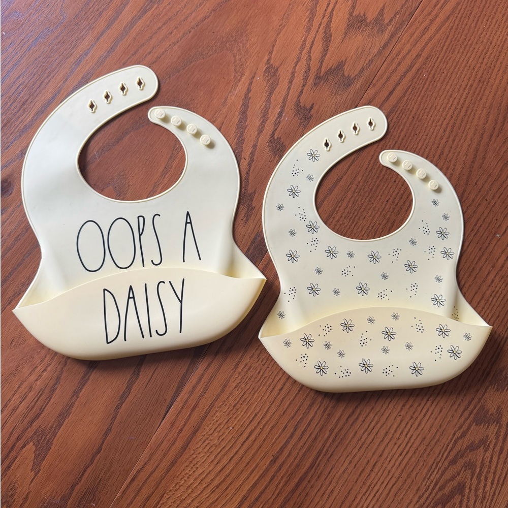 Rae Dunn Cream Silicone Bibs with Daisy Print